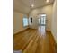 Hardwood floor bedroom with access to bonus room and balcony at 165 Kelmscott Ln., Fayetteville, GA 30214