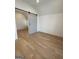 Spacious bedroom with hardwood floors and barn door at 165 Kelmscott Ln., Fayetteville, GA 30214