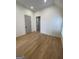 Light-filled bedroom with hardwood floors and ensuite bathroom at 165 Kelmscott Ln., Fayetteville, GA 30214