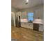 Modern kitchen with white cabinets and stainless steel appliances at 165 Kelmscott Ln., Fayetteville, GA 30214
