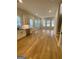 Bright living room with hardwood floors and access to kitchen at 165 Kelmscott Ln., Fayetteville, GA 30214
