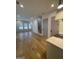 Open living space with hardwood floors and staircase at 165 Kelmscott Ln., Fayetteville, GA 30214