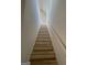 Modern light-wood staircase with white railings at 165 Kelmscott Ln., Fayetteville, GA 30214