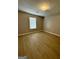 Bright and airy bedroom with light colored walls and flooring at 7983 Trinity Park Dr, Riverdale, GA 30296