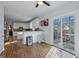 Spacious kitchen with island, white cabinets and sliding door to deck at 5247 Hayden Farms Dr, Powder Springs, GA 30127