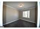 Bright bedroom with carpet, window, and neutral wall color at 4861 Pinnacle Dr, Stone Mountain, GA 30088