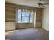 Bedroom with built-in shelving and window seat at 10420 Summer Creek Dr, Alpharetta, GA 30022