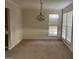 Bright dining room with large windows and chandelier at 10420 Summer Creek Dr, Alpharetta, GA 30022