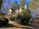 Two-story house with beige siding, dormer windows, and landscaping at 10420 Summer Creek Dr, Alpharetta, GA 30022
