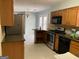 Kitchen with stainless steel appliances and granite countertops at 10420 Summer Creek Dr, Alpharetta, GA 30022