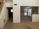 View of living room and stairs leading to upper level at 10420 Summer Creek Dr, Alpharetta, GA 30022