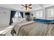 Main bedroom with lake view, king-size bed, and access to a deck at 405 Miller Rd, Covington, GA 30014