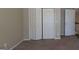 Well-lit bedroom with double door closet and carpet flooring at 2673 Northforke Ct, Tucker, GA 30084