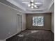 Large bedroom with carpet, ceiling fan and window at 2673 Northforke Ct, Tucker, GA 30084