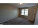 Well-lit bedroom with window and door at 2673 Northforke Ct, Tucker, GA 30084