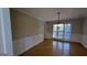 Bright dining room with hardwood floors and wainscoting at 2673 Northforke Ct, Tucker, GA 30084