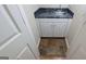 Small wet bar with granite countertop and tile floor at 2673 Northforke Ct, Tucker, GA 30084