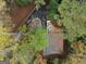 Aerial view showcasing home's deck and wooded lot at 1153 Dawn View Nw Ln, Atlanta, GA 30327