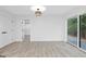 Spacious basement room with sliding glass doors and hardwood floors at 1153 Dawn View Nw Ln, Atlanta, GA 30327