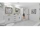 Elegant bathroom with double vanity, marble flooring, and modern fixtures at 1153 Dawn View Nw Ln, Atlanta, GA 30327