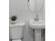 Small bathroom with pedestal sink and toilet at 1153 Dawn View Nw Ln, Atlanta, GA 30327