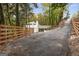 Private driveway to a contemporary home nestled in the woods at 1153 Dawn View Nw Ln, Atlanta, GA 30327