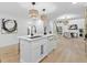 Modern kitchen with white cabinets, quartz countertops, and island at 1153 Dawn View Nw Ln, Atlanta, GA 30327