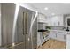 Stainless steel appliances and gold accents in modern kitchen at 1153 Dawn View Nw Ln, Atlanta, GA 30327