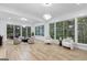 Bright living room with hardwood floors, large windows and comfortable seating at 1153 Dawn View Nw Ln, Atlanta, GA 30327