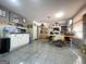 Bright dining area with tile floors and views to kitchen and living room at 200 Kensington Trce, Stockbridge, GA 30281