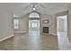 Spacious living room featuring hardwood floors and a cozy fireplace at 155 Rehobeth Way, Fayetteville, GA 30214