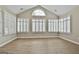 Bright sunroom with multiple windows and hardwood floors at 155 Rehobeth Way, Fayetteville, GA 30214