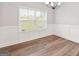 Bright dining room with wainscoting and chandelier at 253 Gordon Oaks Way, Moreland, GA 30259