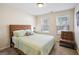 Bedroom with a queen bed and leather chair at 429 Burgundy Se Ter, Atlanta, GA 30354