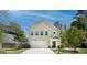 Inviting two-story home features a neutral color scheme, well-manicured lawn, and an attached two-car garage at 429 Burgundy Se Ter, Atlanta, GA 30354