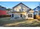 Tan house exterior with a small patio and fenced yard at 429 Burgundy Se Ter, Atlanta, GA 30354