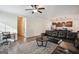 Open-concept living room featuring hardwood floors, neutral paint, and a cozy seating area at 429 Burgundy Se Ter, Atlanta, GA 30354