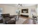 Living room with sectional sofa, large TV, and home office space at 429 Burgundy Se Ter, Atlanta, GA 30354