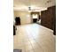 Spacious finished basement features tile floors, and a brick accent wall at 504 Plantation Creek Dr, Loganville, GA 30052
