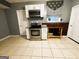 Stainless steel appliances and granite countertops in this galley kitchen at 504 Plantation Creek Dr, Loganville, GA 30052