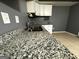 Granite countertop kitchen with double sink and white cabinets at 504 Plantation Creek Dr, Loganville, GA 30052