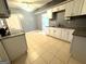 White cabinets and granite countertops in this galley kitchen at 504 Plantation Creek Dr, Loganville, GA 30052