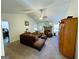Spacious living room with vaulted ceiling, fireplace and L-shaped sofa at 504 Plantation Creek Dr, Loganville, GA 30052