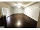 Large living area with dark hardwood floors and French doors at 504 Plantation Creek Dr, Loganville, GA 30052