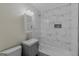 Bathroom with tub, gray vanity, and marble tile shower at 1256 Elizabeth Sw Ave, Atlanta, GA 30310