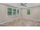 Bright bedroom with laminate floors and multiple windows at 1256 Elizabeth Sw Ave, Atlanta, GA 30310