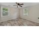 Bright bedroom with wood-look floors and ceiling fan at 1256 Elizabeth Sw Ave, Atlanta, GA 30310