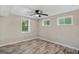 Well-lit bedroom with wood-look floors and multiple windows at 1256 Elizabeth Sw Ave, Atlanta, GA 30310