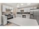 Modern kitchen with white cabinets, stainless steel appliances and island at 1256 Elizabeth Sw Ave, Atlanta, GA 30310