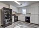 Kitchen with white shaker cabinets, black appliances and grey flooring at 5495 Reynolds Rd, Morrow, GA 30260